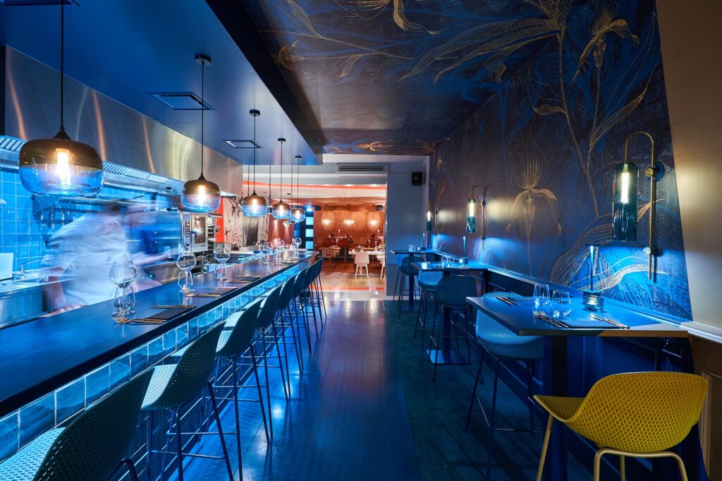 The Blue Orchid wallcover by daisy james in a hospitality interior