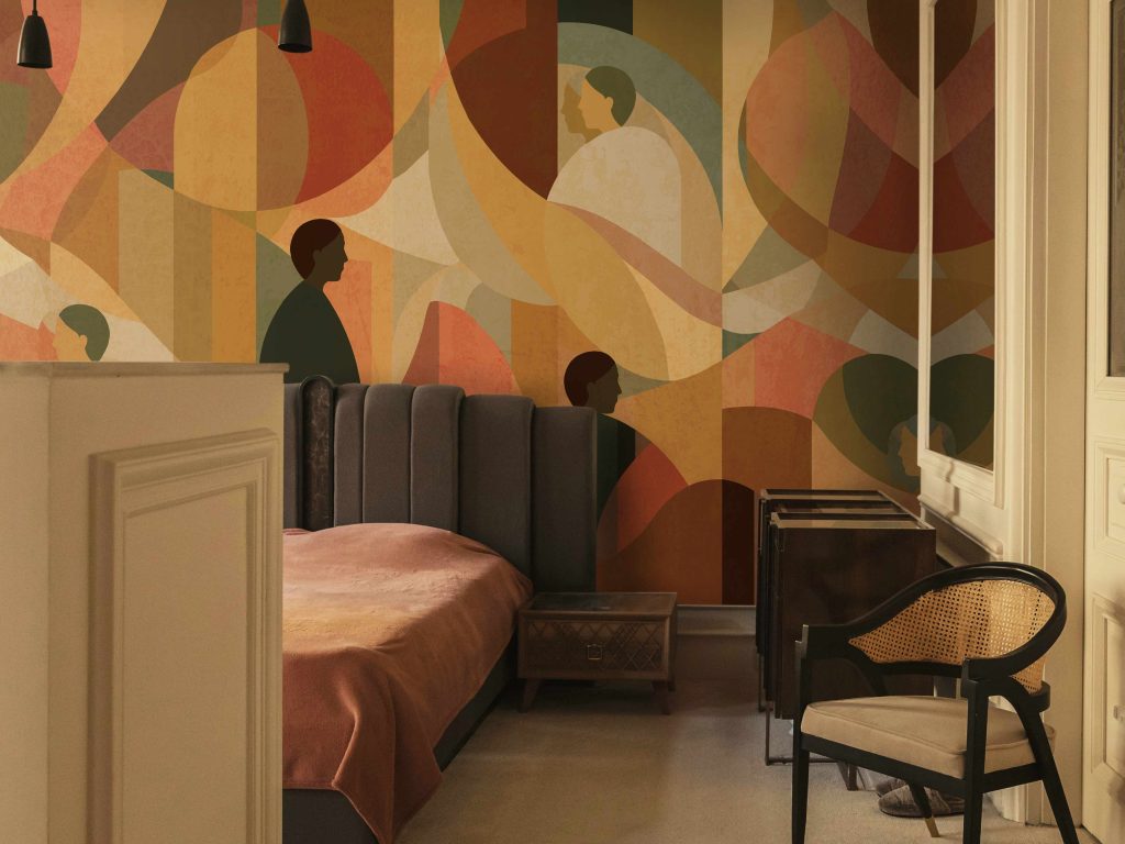 The Sun seamless wallcover creating warmth in a modern bedroom interior.
