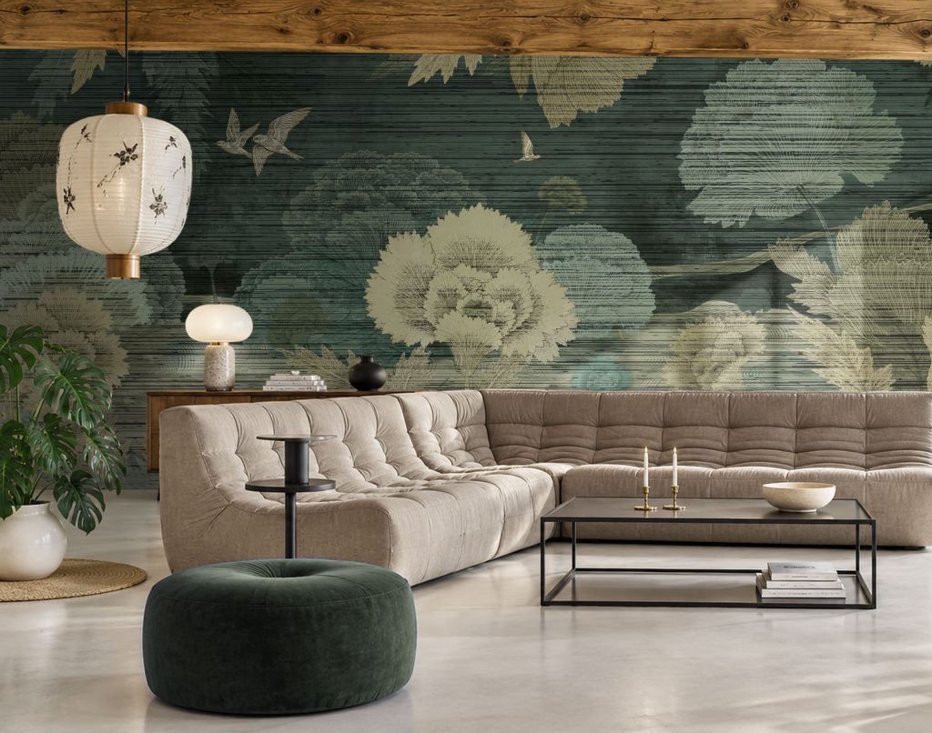 The Miori luxury botanical wallcovering in an atmospheric interior with designer furniture and exposed wooden ceiling beams.